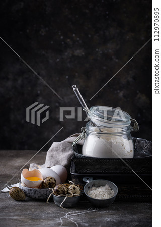 Baking ingredients with flour and eggs 112970895