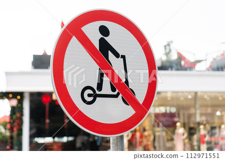 Road sign prohibiting riding electric scooters. 112971551