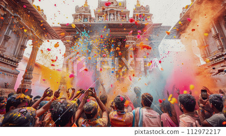 Holi festival, indian people throwing colorful powder in front of an Indian temple Holi festival, indian people throwing colorful powder in front of an Indian temple 112972217