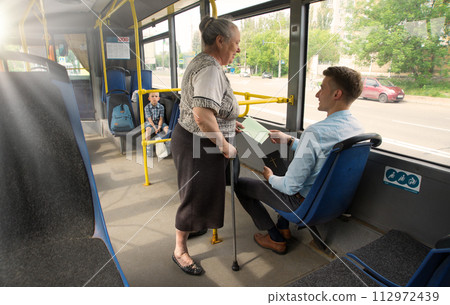 A man evangelizes in public transport A man evangelizes in public transport 112972439