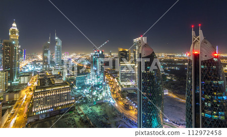 Skyline view of the buildings of Sheikh Zayed Road and DIFC night timelapse in Dubai, UAE. 112972458