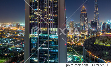 Dubai downtown skyline night timelapse with tallest building and Sheikh Zayed road traffic, UAE 112972461