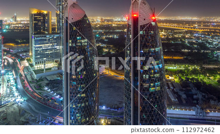 Skyline view of the buildings of Sheikh Zayed Road and DIFC night timelapse in Dubai, UAE. 112972462