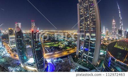 Skyline view of the buildings of Sheikh Zayed Road and DIFC night timelapse in Dubai, UAE. 112972463
