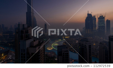 Foggy morning in downtown of Dubai night to day timelapse. 112972539