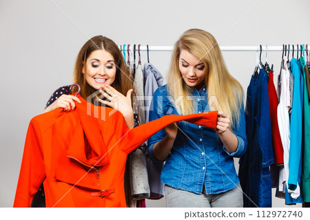 Two women on clothes shopping Two women on clothes shopping 112972740
