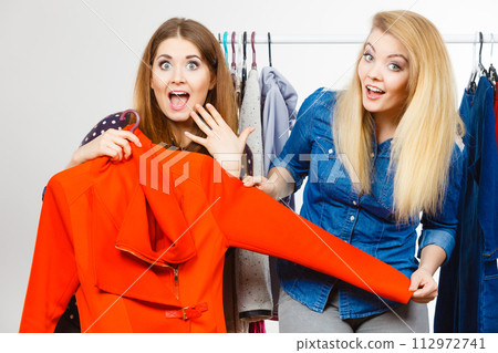 Two women on clothes shopping Two women on clothes shopping 112972741