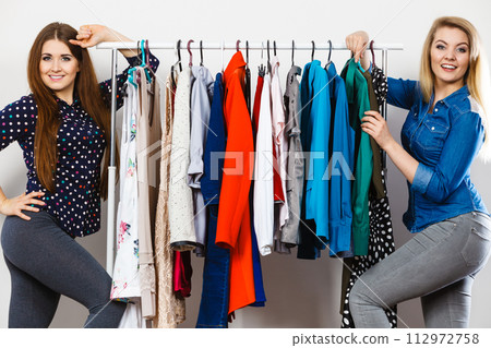 Happy women clothes shopping Happy women clothes shopping 112972758