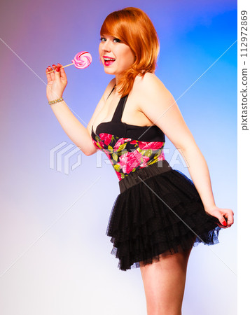 Young girl and sweet lollipop. Young girl and sweet lollipop. 112972869