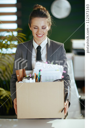 happy modern 40 years old woman worker in modern green office happy modern 40 years old woman worker in modern green office 112973163