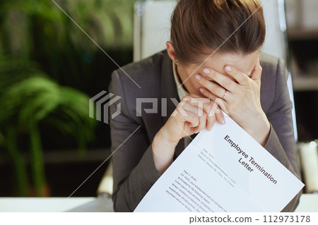 Closeup on modern woman worker in modern green office 112973178