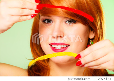 Woman with lot of sweets. Woman with lot of sweets. 112973184