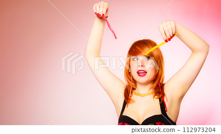 Woman with lot of sweets. 112973204