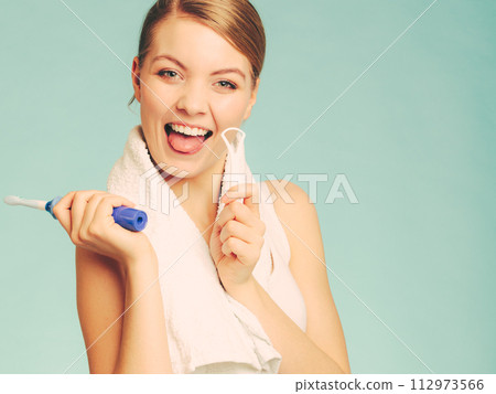 Girl with brush and tongue cleaner. 112973566