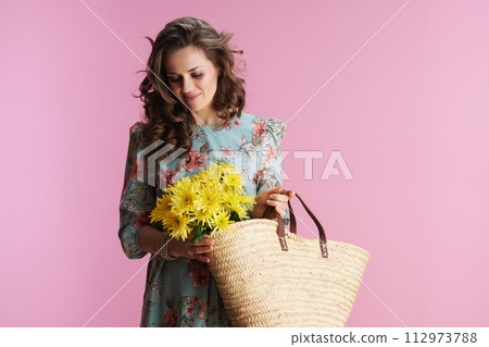 smiling modern woman with long wavy brunette hair on pink 112973788