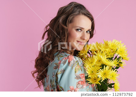 smiling elegant woman with long wavy brunette hair on pink smiling elegant woman with long wavy brunette hair on pink 112973792