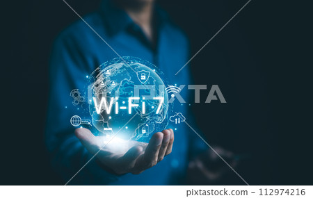 Global Wi-Fi Connectivity and Internet Technology Concept. A person holding a holographic globe highlighting Wi-Fi 7 connectivity, representing the global reach of modern internet technology. wifi7, 112974216