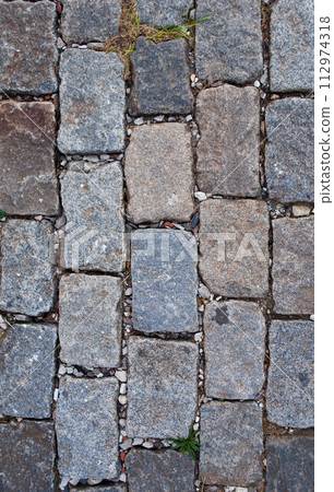 Grey stone pavement background Grey stone pavement background 112974318