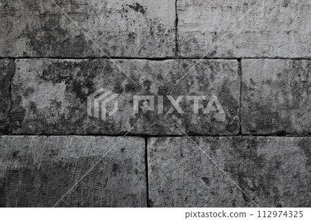Old gray concrete block wall 112974325