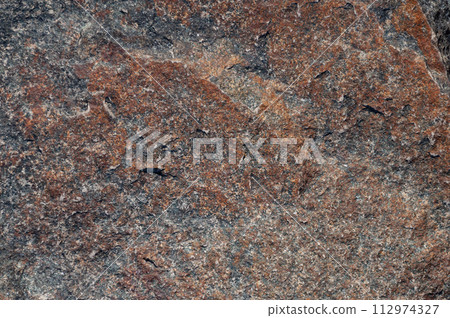 Dark brown stone background Dark brown stone background 112974327