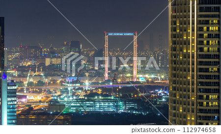 Dubai skyline night timelapse with Deira district Dubai skyline night timelapse with Deira district 112974658
