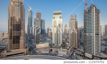 Beautiful aerial top view day to night transition timelapse of Dubai Marina canal 112974702