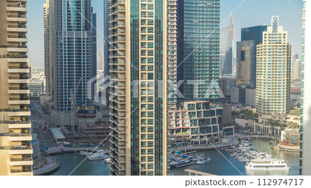 Amazing colorful dubai marina skyline during sunset timelapse 112974717