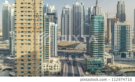 Amazing colorful dubai marina skyline during sunset timelapse 112974718