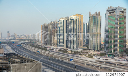 Amazing rooftop view on Sheikh Zayed road surrounded Dubai Marina and JLT skyscrapers 112974907