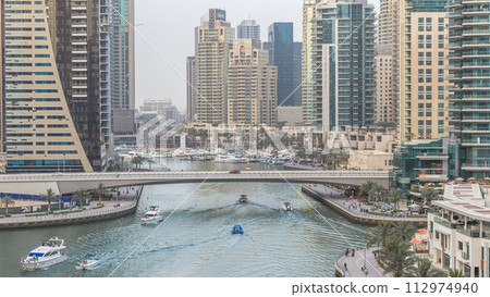 Beautiful aerial top view day to night transition timelapse of Dubai Marina canal 112974940