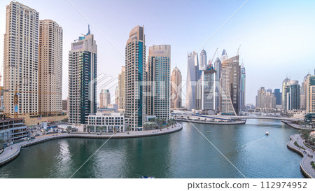 Beautiful aerial top view day to night transition timelapse of Dubai Marina canal 112974952