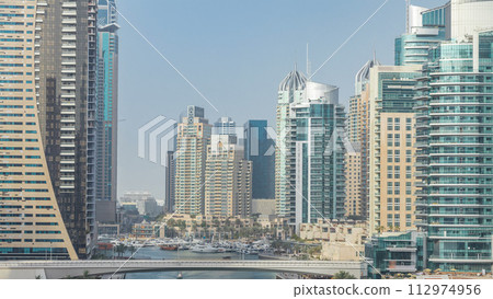 Amazing colorful dubai marina skyline during sunset timelapse Amazing colorful dubai marina skyline during sunset timelapse 112974956