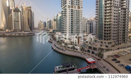 Amazing colorful dubai marina skyline during sunset timelapse 112974960