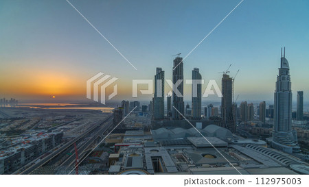 Dubai downtown with sunrise timelapse. Top view from above 112975003