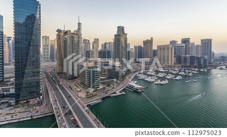 Beautiful aerial top view day to night transition timelapse of Dubai Marina canal 112975023