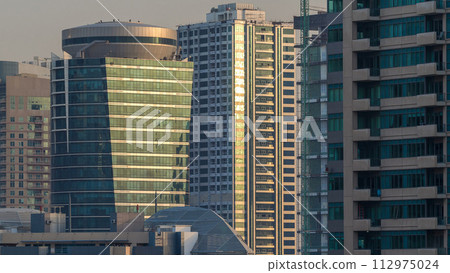 Amazing colorful dubai marina skyline during sunset timelapse Amazing colorful dubai marina skyline during sunset timelapse 112975024
