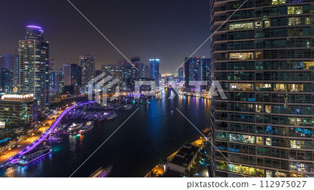 Water canal on Dubai Marina skyline at night timelapse. Water canal on Dubai Marina skyline at night timelapse. 112975027