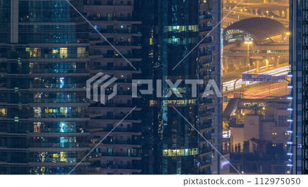 Water canal on Dubai Marina skyline at night timelapse. Water canal on Dubai Marina skyline at night timelapse. 112975050
