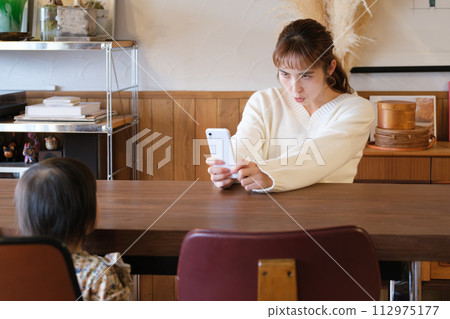 mother taking care of her child 112975177