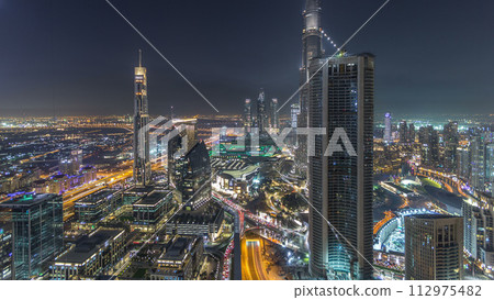 Dubai Downtown night timelapse modern towers panoramic view from the top in Dubai, United Arab Emirates. 112975482