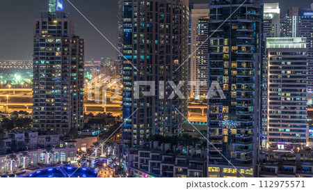 Dubai Marina at night timelapse, Glittering lights and tallest skyscrapers Dubai Marina at night timelapse, Glittering lights and tallest skyscrapers 112975571