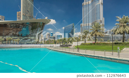Burj park with fountain pool timelapse hyperlapse. 112976643