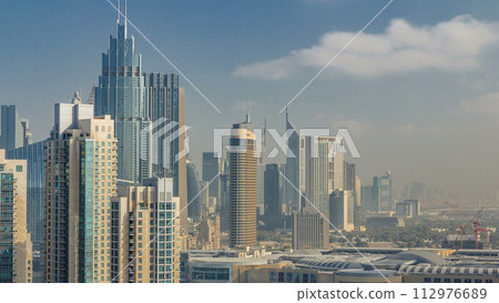 Downtown Dubai skyline with skyscrapers and towers timelapse, view from rooftop. Downtown Dubai skyline with skyscrapers and towers timelapse, view from rooftop. 112976689