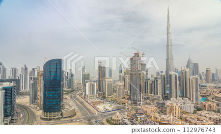 Downtown Dubai skyline with residential towers timelapse, view from rooftop. 112976743