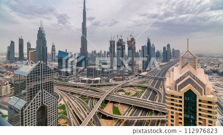 Dubai skyline timelapse at sunset with city center skyscrapers and Sheikh Zayed road traffic, Dubai, United Arab Emirates Dubai skyline timelapse at sunset with city center skyscrapers and Sheikh Zayed road traffic, Dubai, United Arab Emirates 112976823