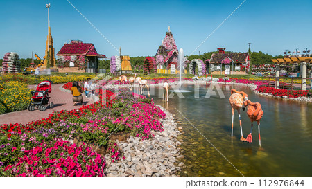 Dubai miracle garden timelapse with over 45 million flowers in a sunny day, United Arab Emirates 112976844