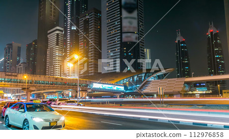 Downtown Dubai towers night timelapse. View of Sheikh Zayed road with skyscrapers. 112976858