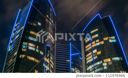 Famous towers buildings in Abu Dhabi night timelapse hyperlapse. Famous towers buildings in Abu Dhabi night timelapse hyperlapse. 112976906