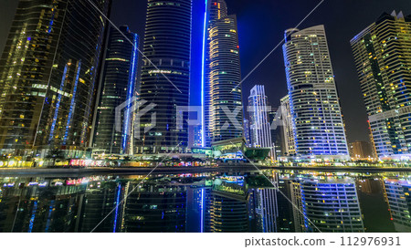 Residential buildings in Jumeirah Lake Towers timelapse hyperlapse in Dubai, UAE. 112976931