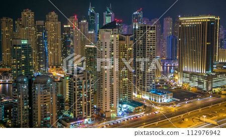 Aerial top view at night timelapse of Dubai Marina in Dubai, UAE Aerial top view at night timelapse of Dubai Marina in Dubai, UAE 112976942